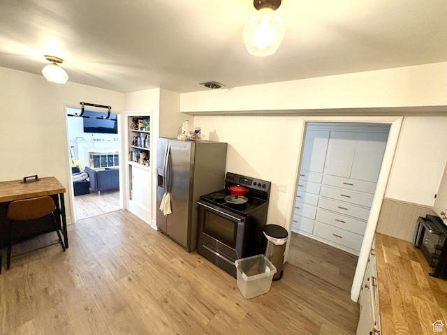 776 S Cherry Dr W, Orem, UT 84058 - kitchen with stainless steel appliances, light wood-type flooring, white cabinets, and wooden counters
