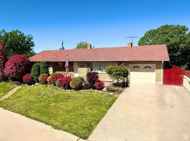 776 S Cherry Dr W, Orem, UT 84058 - single story home featuring a garage, brick siding, concrete driveway, a chimney, and a tile roof