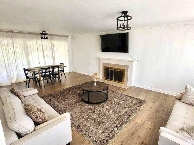 776 S Cherry Dr W, Orem, UT 84058 - living area featuring wood finished floors, a fireplace, and baseboards