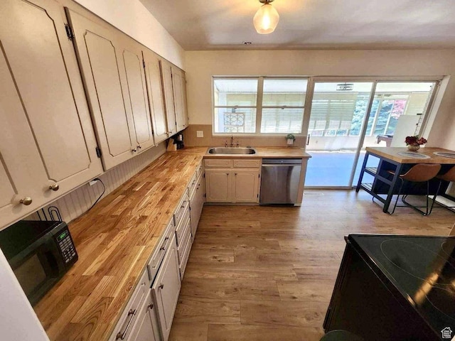 776 S Cherry Dr W, Orem, UT 84058 - kitchen with black appliances, a sink, light wood-style floors, and butcher block countertops