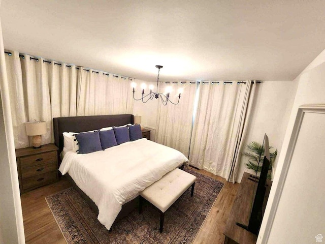 776 S Cherry Dr W, Orem, UT 84058 - bedroom featuring a chandelier and wood finished floors