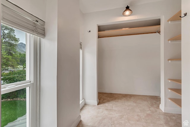 233 N Main St, Alpine, UT 84004 - corridor featuring light tile patterned flooring and baseboards