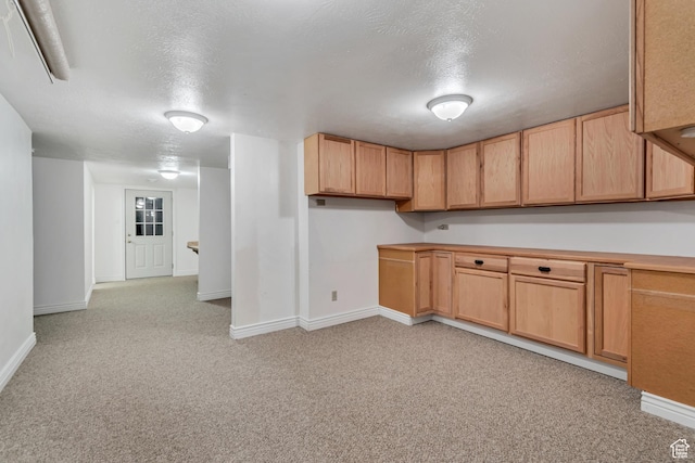 233 N Main St, Alpine, UT 84004 - kitchen with baseboards, light colored carpet, a textured ceiling, and light brown cabinetry
