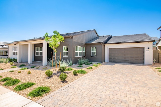705 W Emerald Point Dr, St George, UT 84790 - ranch-style home with decorative driveway, an attached garage, and stucco siding