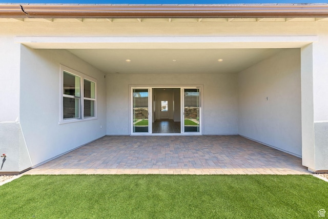 705 W Emerald Point Dr, St George, UT 84790 - back of property featuring stucco siding and a patio