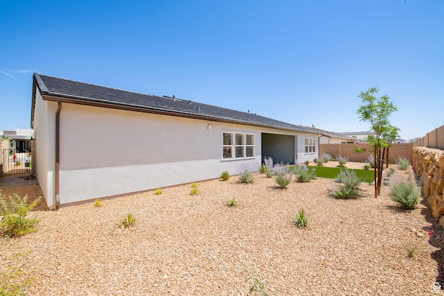 705 W Emerald Point Dr, St George, UT 84790 - back of property featuring a fenced backyard and stucco siding