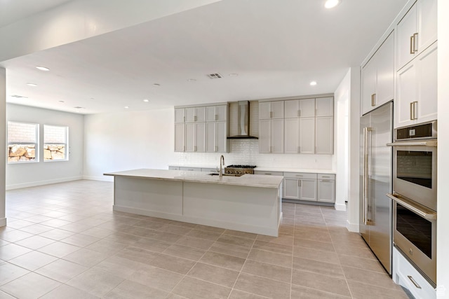705 W Emerald Point Dr, St George, UT 84790 - kitchen featuring wall chimney range hood, stainless steel appliances, tasteful backsplash, light tile patterned floors, and recessed lighting