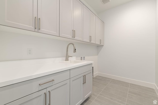 705 W Emerald Point Dr, St George, UT 84790 - laundry room with washer hookup, cabinet space, baseboards, and light tile patterned flooring