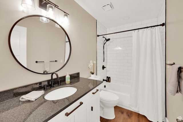 10132 S Kalinda Dr, Sandy, UT 84092 - bathroom with toilet, vanity, shower / bath combo with shower curtain, and wood finished floors