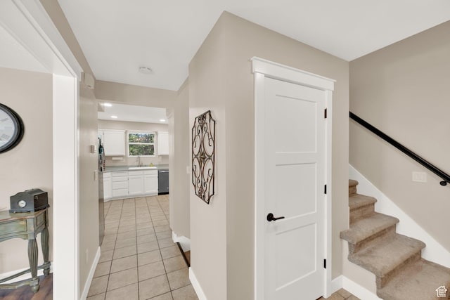 10132 S Kalinda Dr, Sandy, UT 84092 - hallway with light tile patterned flooring, a sink, baseboards, recessed lighting, and stairway