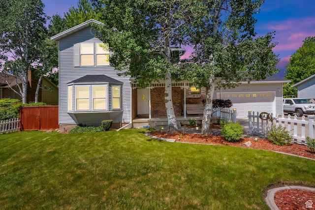 10132 S Kalinda Dr, Sandy, UT 84092 - view of front facade with a porch, concrete driveway, and an attached garage