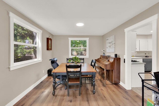 10132 S Kalinda Dr, Sandy, UT 84092 - dining space with light wood-type flooring and baseboards
