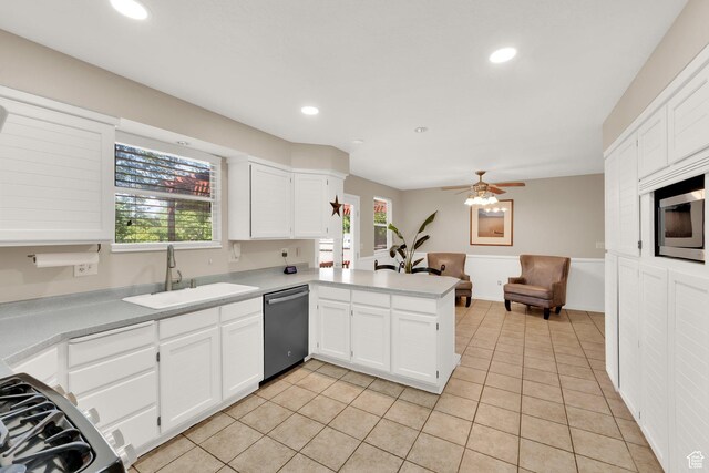 10132 S Kalinda Dr, Sandy, UT 84092 - kitchen featuring dishwasher, a sink, a peninsula, white cabinets, and recessed lighting