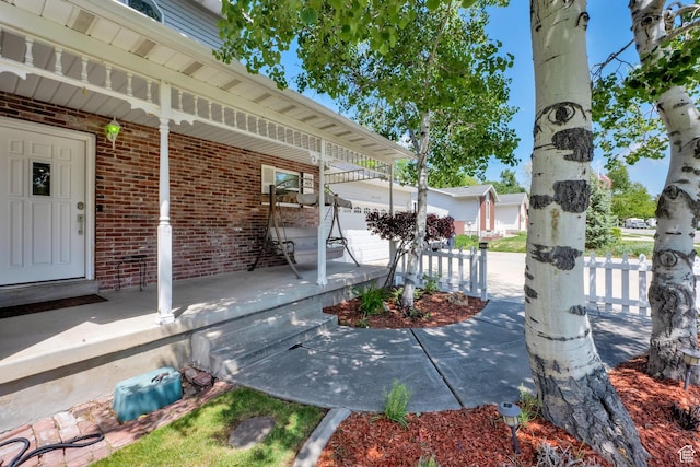 10132 S Kalinda Dr, Sandy, UT 84092 - covered porch featuring an outbuilding
