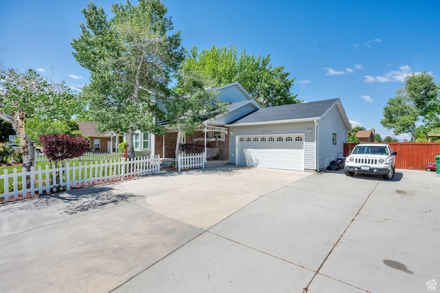10132 S Kalinda Dr, Sandy, UT 84092 - view of front of house with an attached garage and driveway