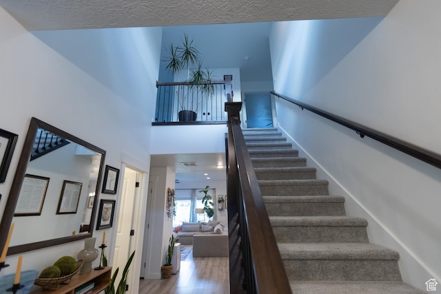 172 N 200 E, Salem, UT 84653 - staircase featuring wood finished floors and a textured ceiling