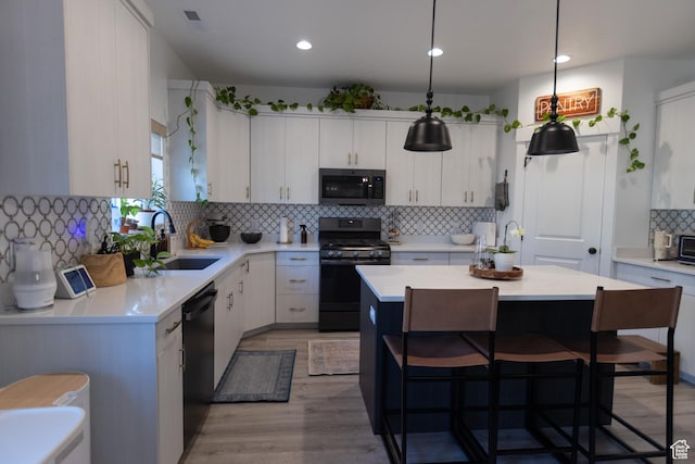 172 N 200 E, Salem, UT 84653 - kitchen with range with gas cooktop, stainless steel microwave, decorative backsplash, a sink, and light countertops