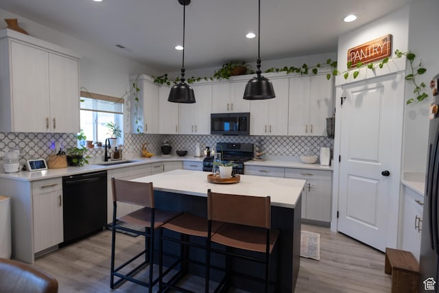 172 N 200 E, Salem, UT 84653 - kitchen with range with gas stovetop, dishwasher, a sink, light wood-style floors, and recessed lighting