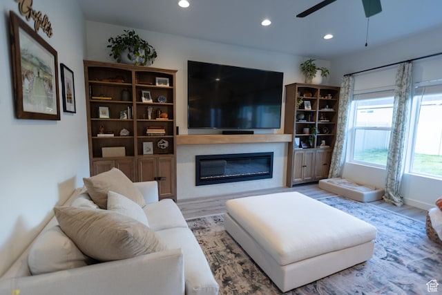 172 N 200 E, Salem, UT 84653 - living area with a glass covered fireplace, wood finished floors, recessed lighting, and a ceiling fan