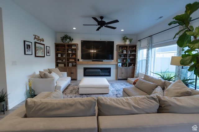 172 N 200 E, Salem, UT 84653 - living area with a glass covered fireplace, ceiling fan, recessed lighting, and baseboards