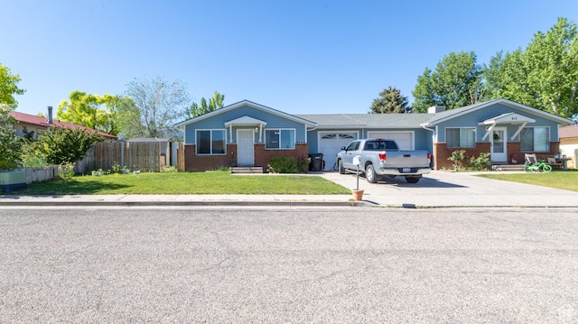 405 Bramblewood Dr, Cedar City, UT 84721 - ranch-style house featuring driveway, an attached garage, and brick siding