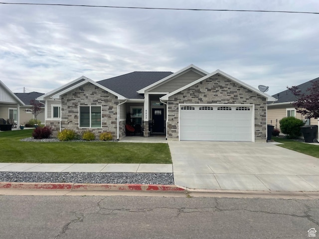 4422 W 2425 N, Plain City, UT 84404 - view of front facade with stone siding, a front lawn, a garage, and driveway