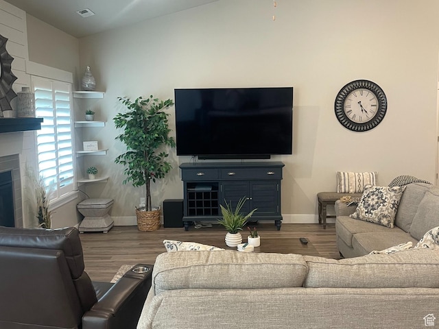 4422 W 2425 N, Plain City, UT 84404 - living room with wood finished floors, baseboards, and a fireplace
