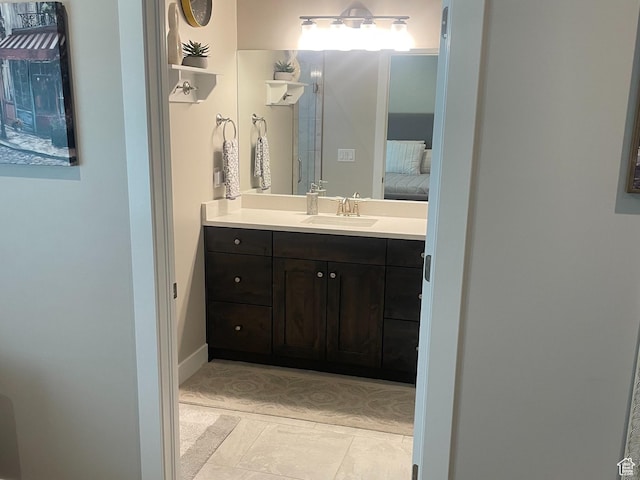 4422 W 2425 N, Plain City, UT 84404 - ensuite bathroom featuring vanity and tile patterned floors