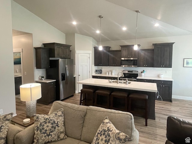 4422 W 2425 N, Plain City, UT 84404 - kitchen featuring stainless steel appliances, lofted ceiling, open floor plan, a sink, and light countertops