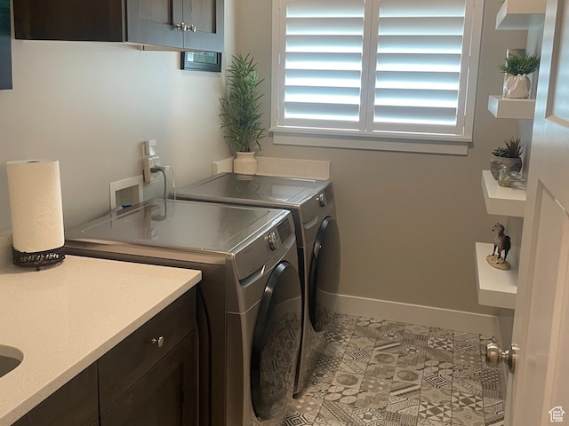 4422 W 2425 N, Plain City, UT 84404 - washroom featuring separate washer and dryer, cabinet space, and baseboards