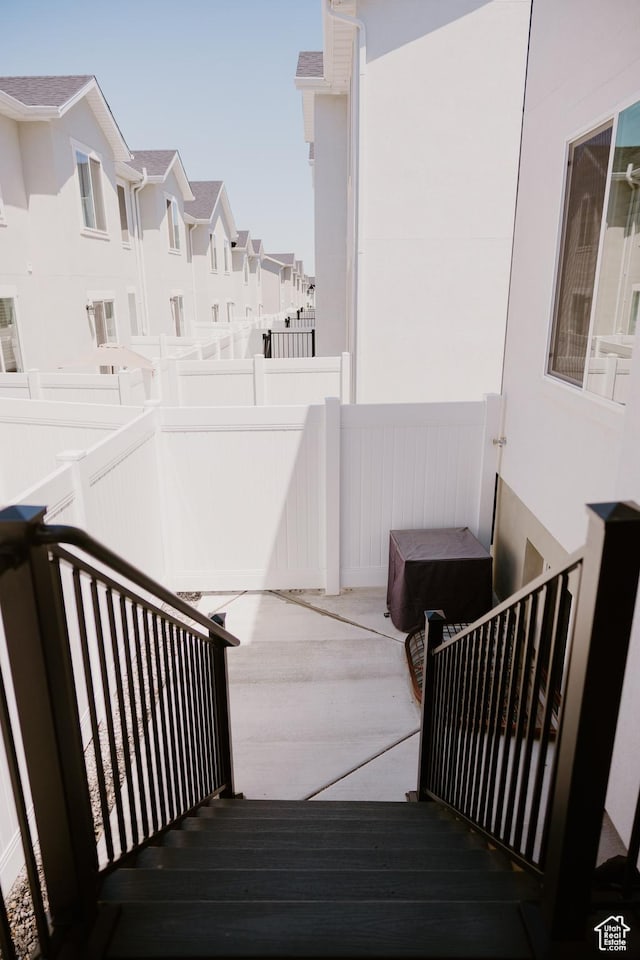 1859 N Blue Iris Ave Unit 1078, Tooele, UT 84074 - staircase featuring a residential view