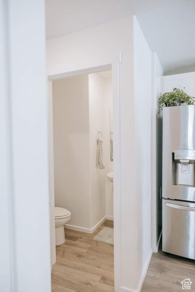 1859 N Blue Iris Ave Unit 1078, Tooele, UT 84074 - bathroom with toilet, wood finished floors, and baseboards