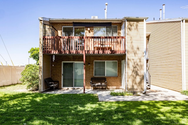 870 N 160 W Unit 3, Orem, UT 84057 - rear view of property with a yard, a patio, and brick siding