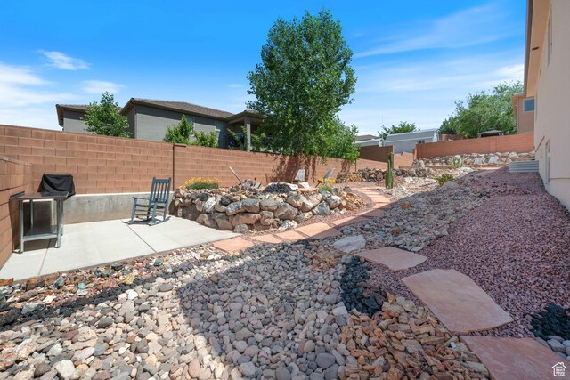 1160 N Main St, Hurricane, UT 84737 - fenced backyard with a patio and an outdoor fire pit