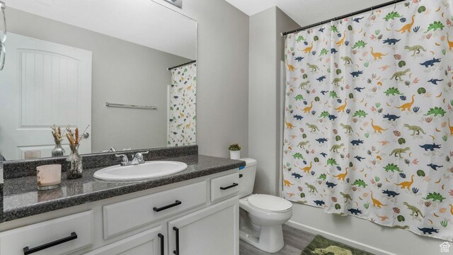156 W Springview Dr Unit 505, Saratoga Springs, UT 84045 - full bathroom featuring vanity, toilet, wood finished floors, and shower / tub combo