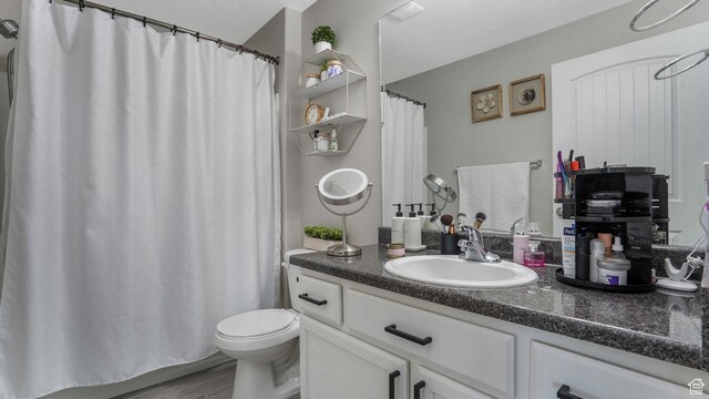 156 W Springview Dr Unit 505, Saratoga Springs, UT 84045 - bathroom with vanity, toilet, a shower with shower curtain, and wood finished floors