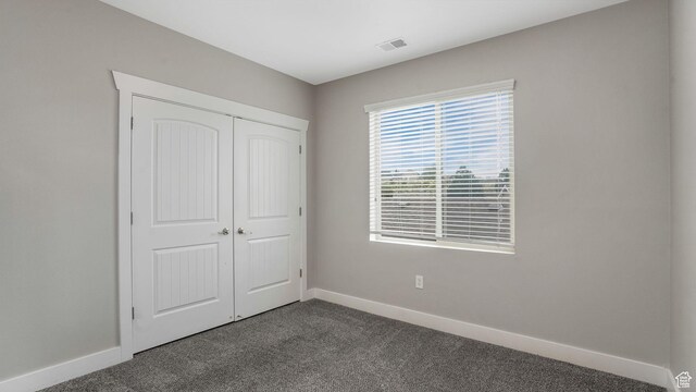 156 W Springview Dr Unit 505, Saratoga Springs, UT 84045 - unfurnished bedroom with carpet, baseboards, and a closet