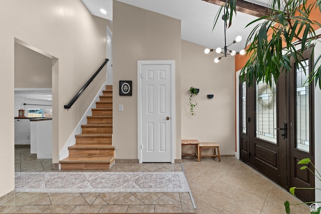 1616 E Waters Ln, Sandy, UT 84093 - foyer entrance with high vaulted ceiling, stairs, a chandelier, and baseboards