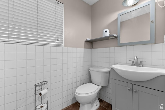 1616 E Waters Ln, Sandy, UT 84093 - bathroom featuring toilet, vanity, and tile walls