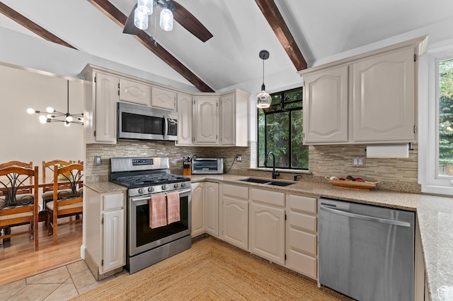 1616 E Waters Ln, Sandy, UT 84093 - kitchen with appliances with stainless steel finishes, a sink, tasteful backsplash, and a ceiling fan