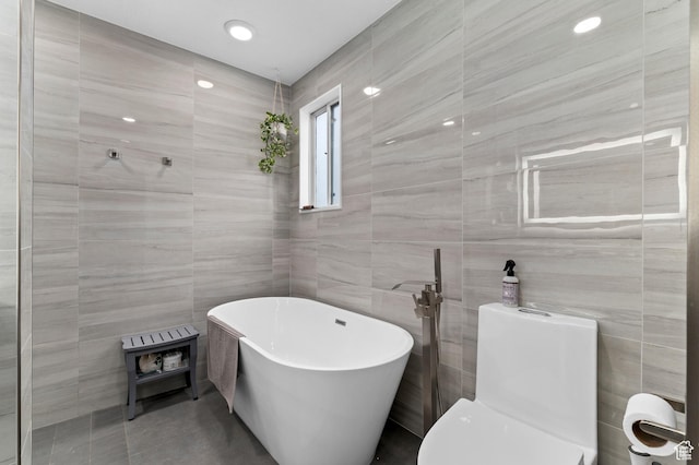 1616 E Waters Ln, Sandy, UT 84093 - bathroom featuring tile walls, a soaking tub, toilet, and tile patterned floors