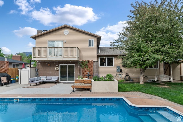 1616 E Waters Ln, Sandy, UT 84093 - rear view of property featuring a balcony, outdoor lounge area, a patio, a chimney, and brick siding