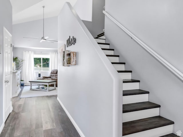 1038 N Plaza Dr, Richfield, UT 84701 - staircase featuring a ceiling fan, wood finished floors, baseboards, and high vaulted ceiling