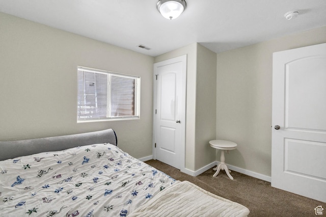 1038 N Plaza Dr, Richfield, UT 84701 - bedroom featuring dark colored carpet and baseboards