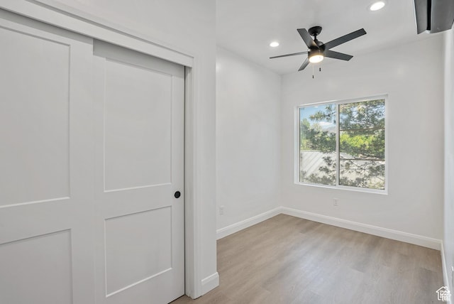 321 E 2100 S Unit 4, Salt Lake City, UT 84115 - unfurnished bedroom with light wood-type flooring, baseboards, recessed lighting, a closet, and ceiling fan