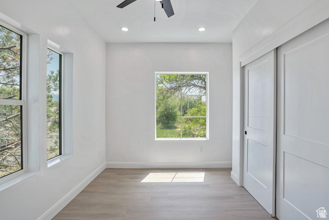 321 E 2100 S Unit 4, Salt Lake City, UT 84115 - unfurnished bedroom featuring baseboards, wood finished floors, recessed lighting, a closet, and ceiling fan