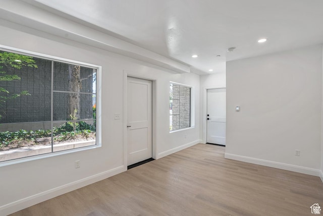 321 E 2100 S Unit 4, Salt Lake City, UT 84115 - entrance foyer with wood finished floors, baseboards, and recessed lighting