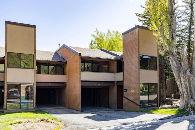1672 Captain Molly Dr Unit 330, Park City, UT 84060 - view of front of home featuring stucco siding, brick siding, and a chimney