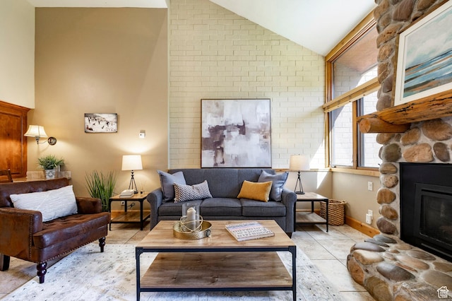 1672 Captain Molly Dr Unit 330, Park City, UT 84060 - living room featuring vaulted ceiling, a fireplace, light tile patterned floors, and baseboards
