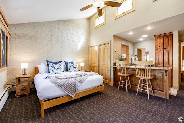 1672 Captain Molly Dr Unit 330, Park City, UT 84060 - bedroom featuring dark carpet, high vaulted ceiling, and a baseboard heating unit